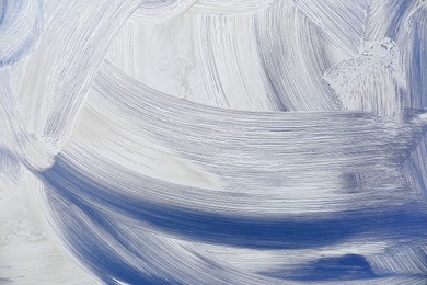 Cleaning foam on window glass, closeup view