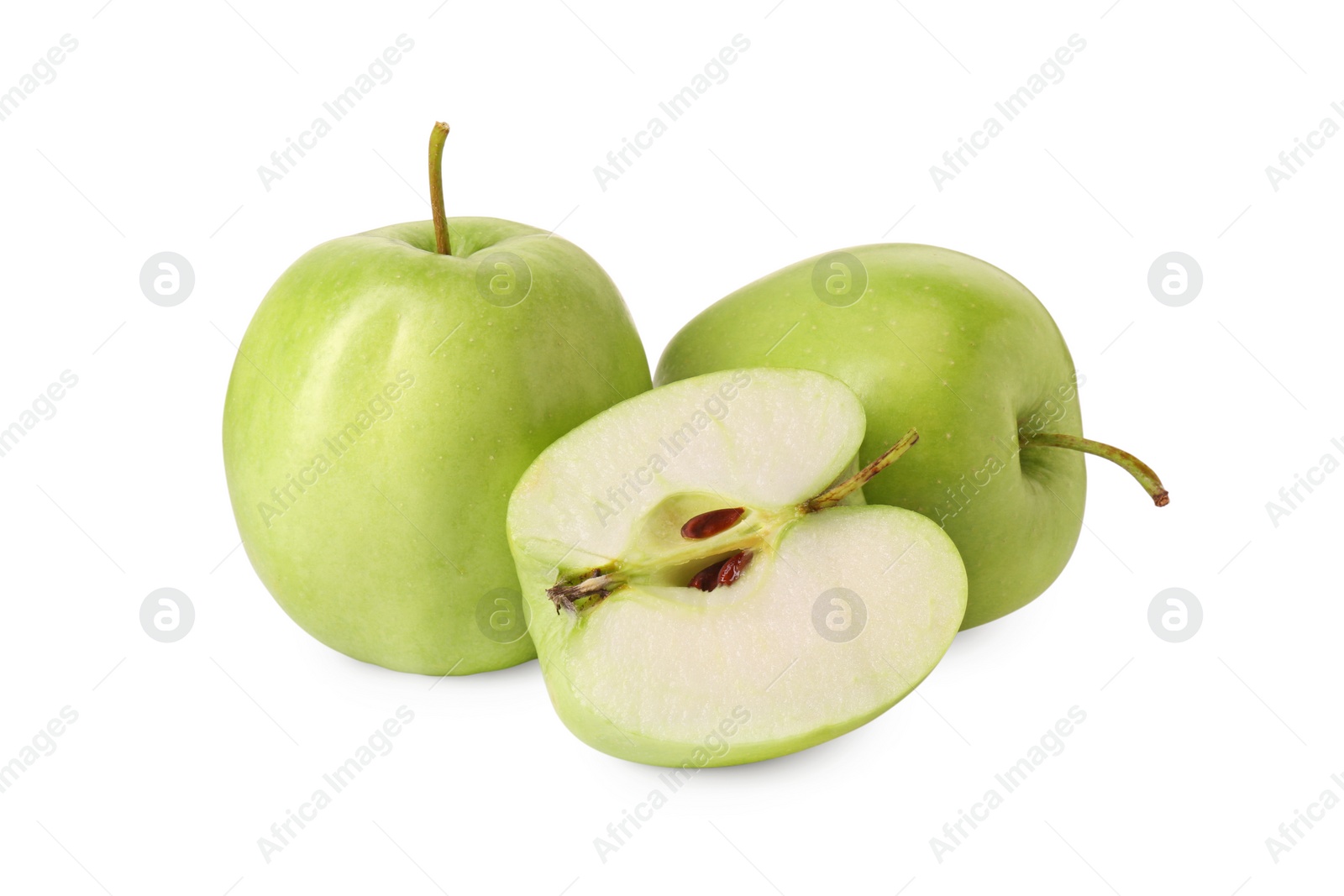 Photo of Whole and cut green apples isolated on white