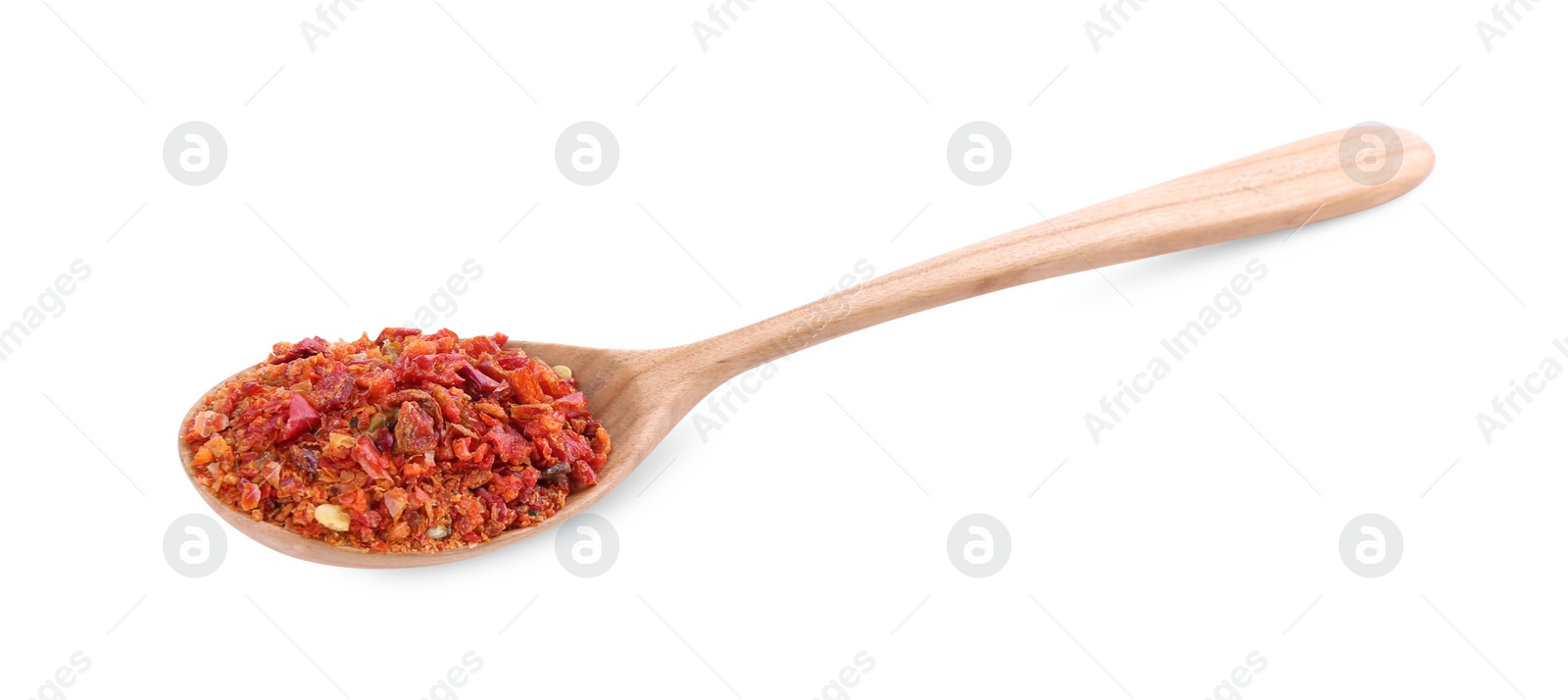 Photo of Aromatic spice. Red chili pepper flakes in spoon isolated on white