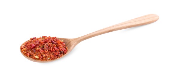 Photo of Aromatic spice. Red chili pepper flakes in spoon isolated on white