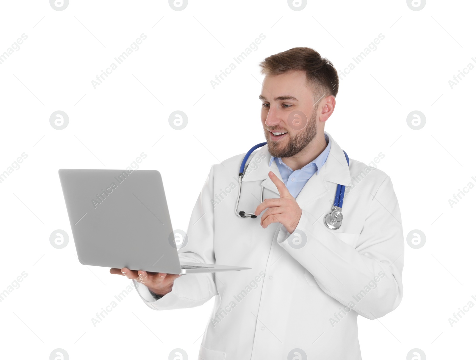 Photo of Male doctor using video chat on laptop against white background