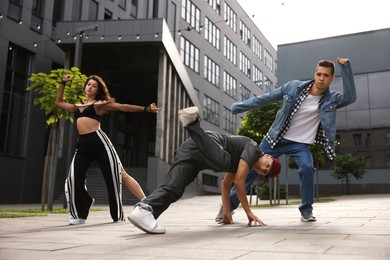 Group of people dancing hip hop outdoors