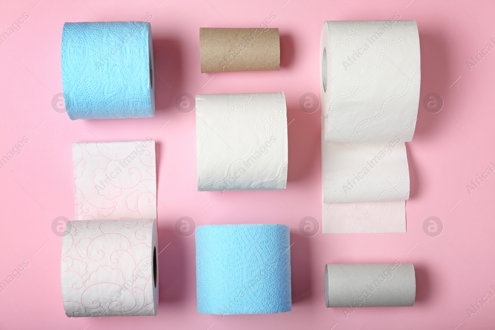 Photo of Flat lay composition with toilet paper on color background