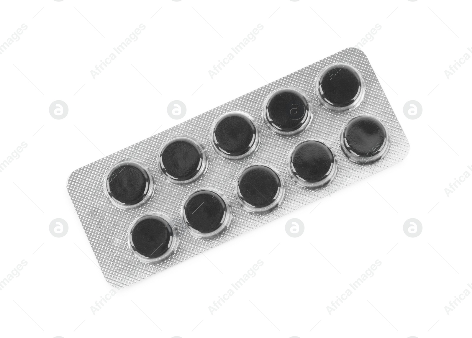 Photo of Activated charcoal pills in blister isolated on white, top view. Potent sorbent
