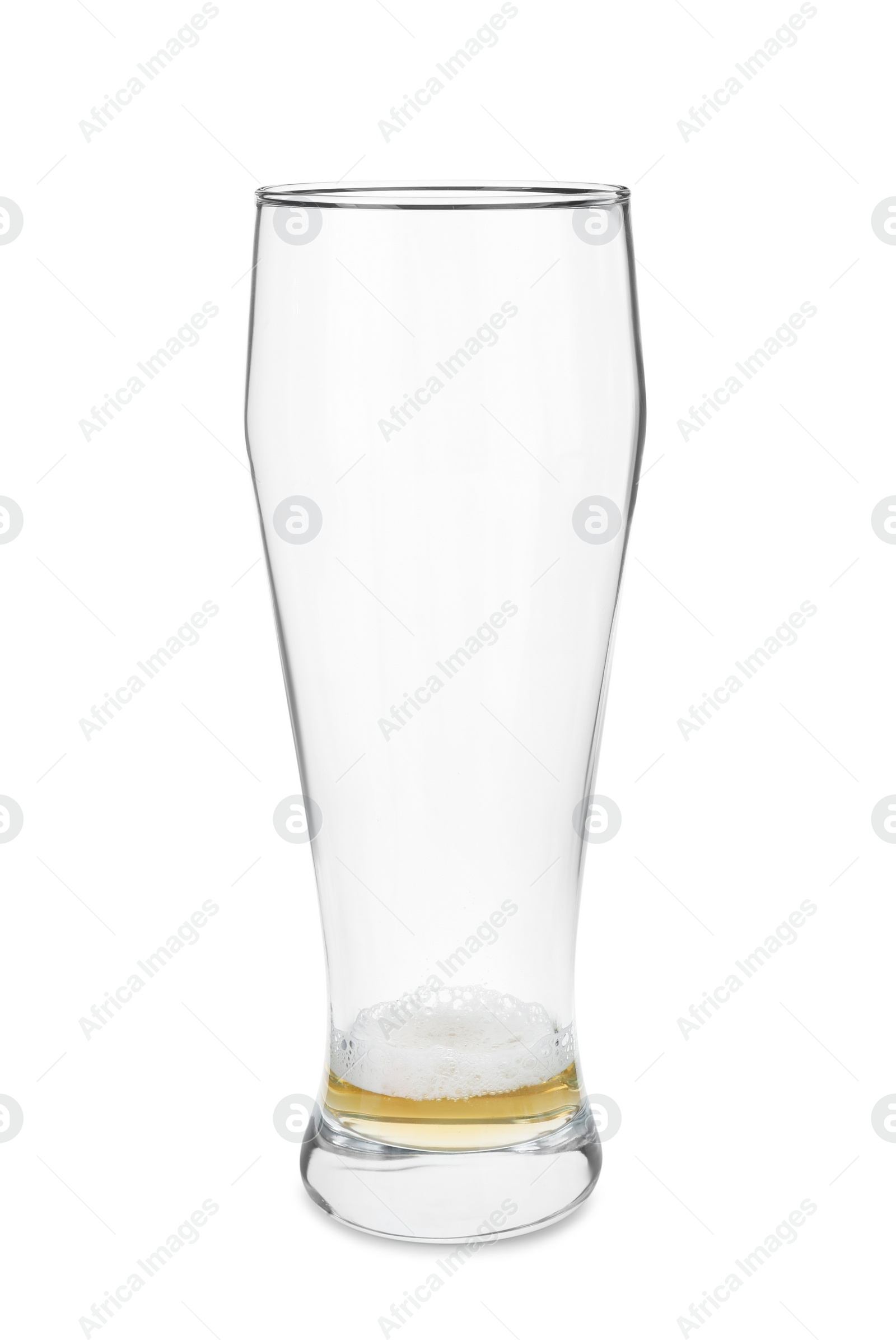 Photo of Almost empty glass of beer isolated on white