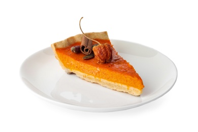 Photo of Slice of delicious homemade pumpkin pie isolated on white