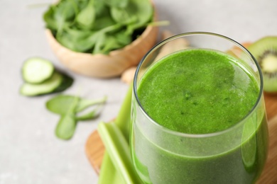 Photo of Delicious fresh green juice in glass, closeup. Space for text