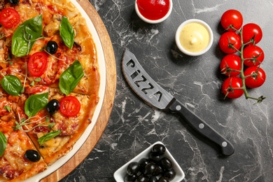 Photo of Flat lay composition with tasty homemade pizza on table