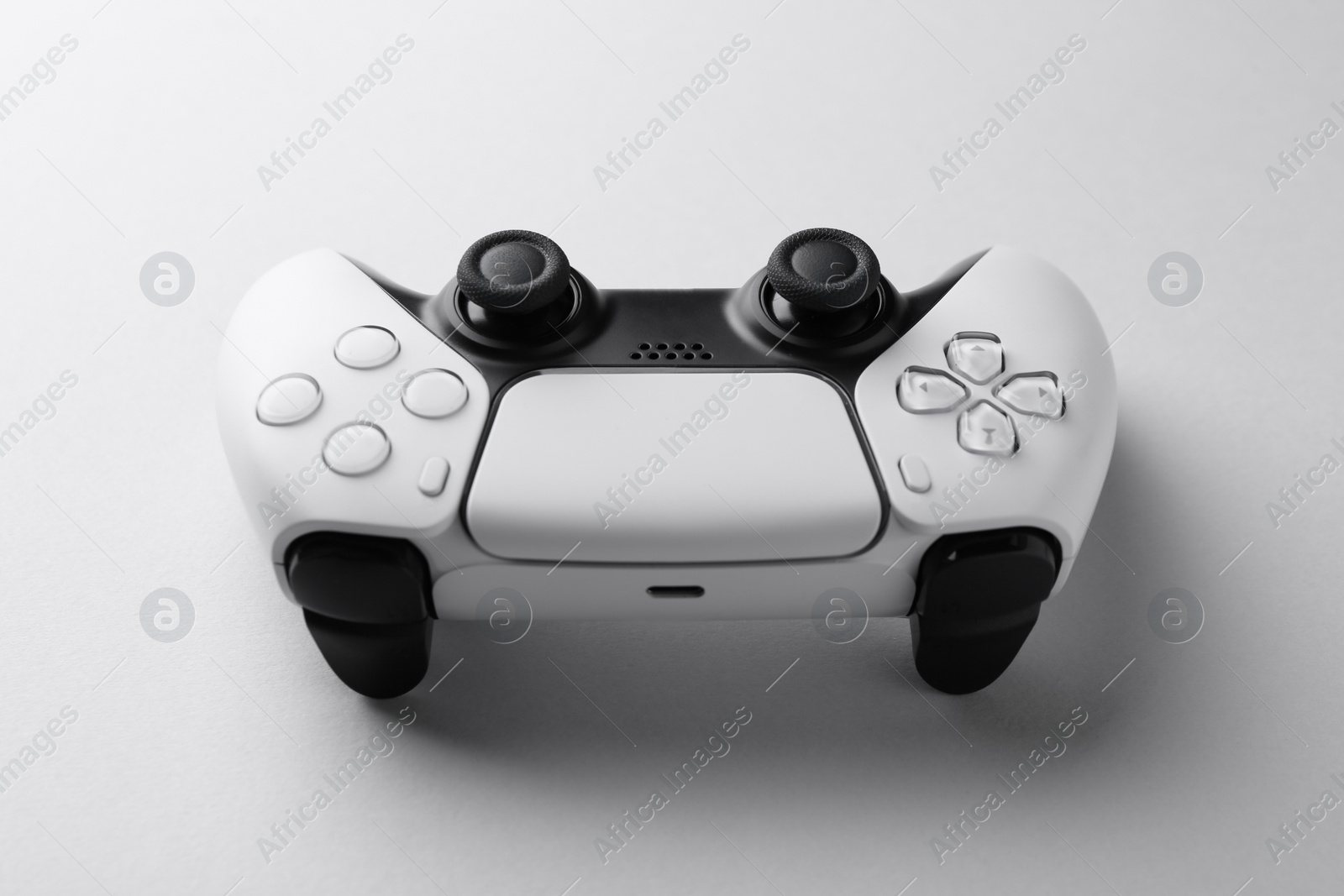 Photo of Wireless game controller on light grey background