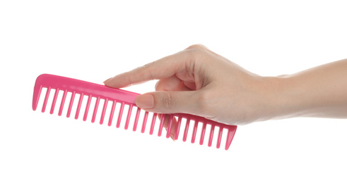 Photo of Woman holding hair comb on white background, closeup