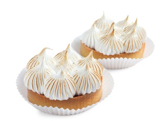 Tartlets with meringue isolated on white. Tasty dessert