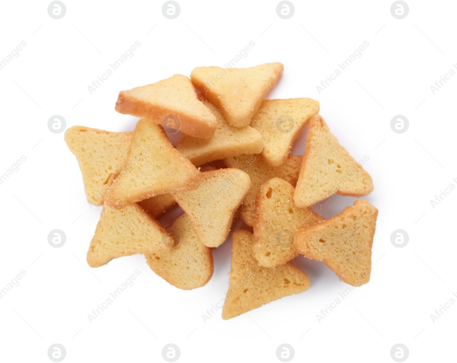 Photo of Pile of delicious crispy rusks on white background, top view