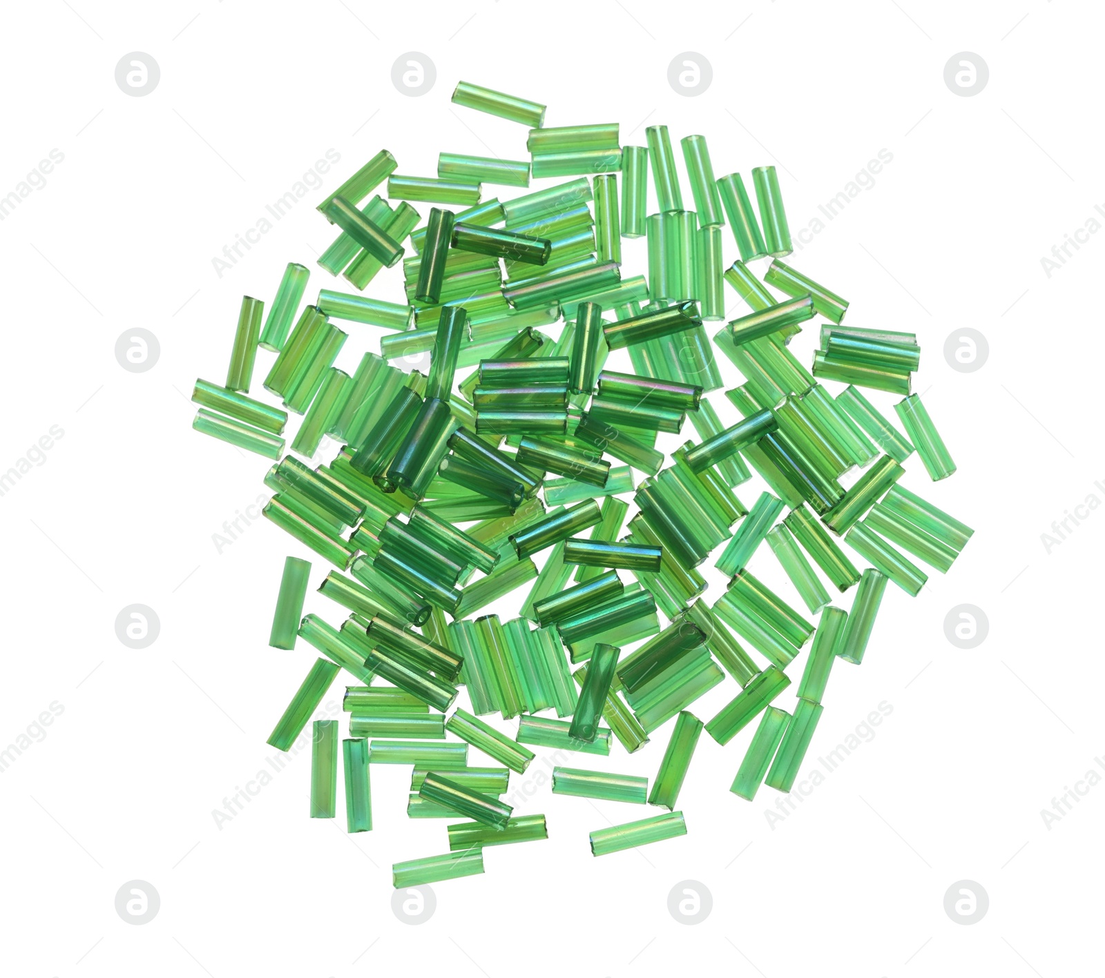 Photo of Pile of green bugle beads on white background, top view