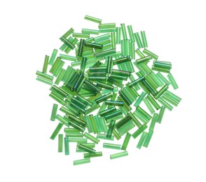 Photo of Pile of green bugle beads on white background, top view
