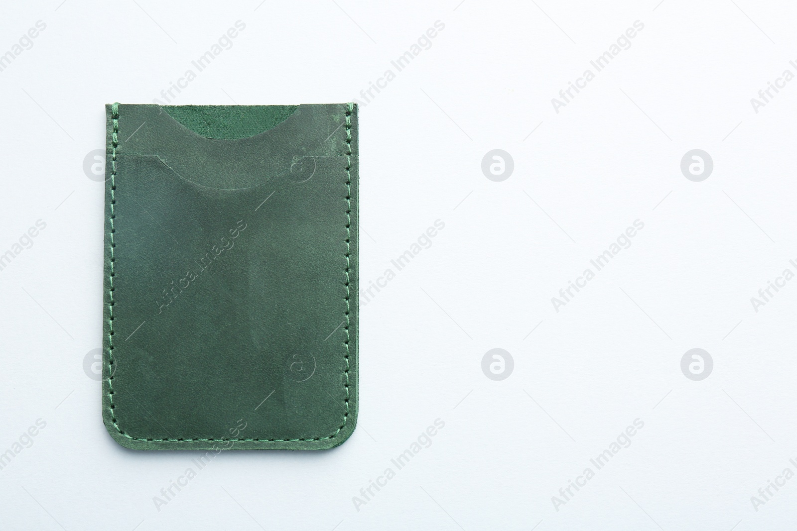 Photo of Empty leather card holder on light grey background, top view. Space for text