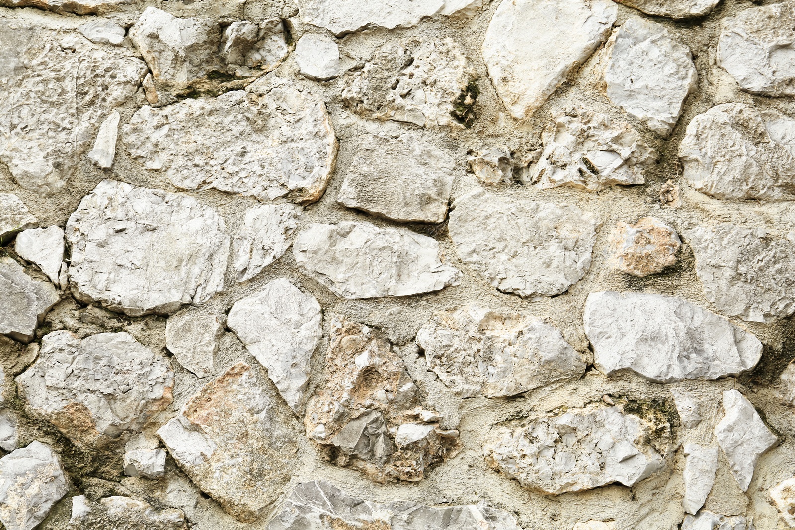 Photo of Texture of stone wall as background, closeup