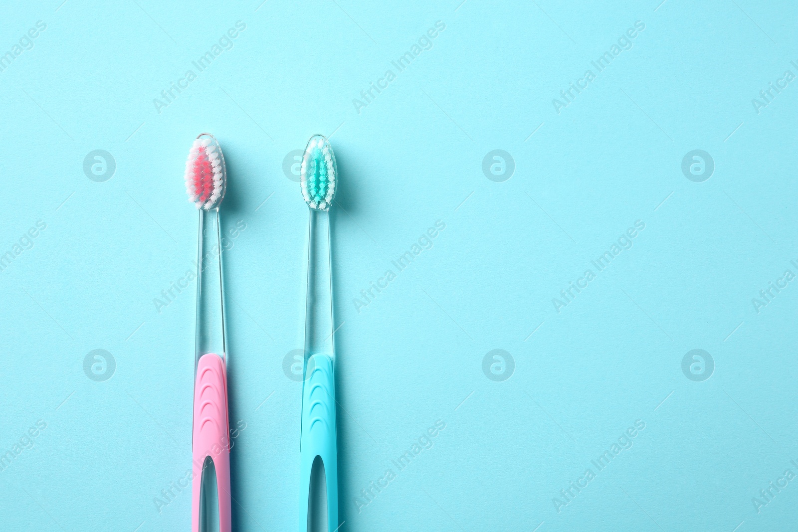 Photo of Manual toothbrushes on color background. Dental care