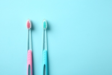 Photo of Manual toothbrushes on color background. Dental care