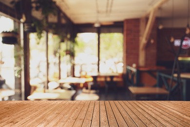 Image of Empty wooden surface in cafe. Space for design