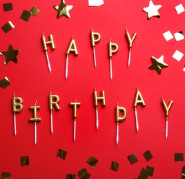 Photo of Flat lay composition with birthday candles on color background