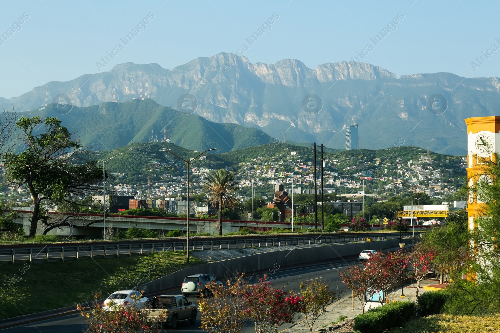 Photo of Picturesque view of city and highway in mountains