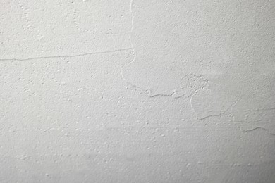 Photo of Wall covered with plaster as background, closeup