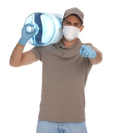 Courier in medical mask holding bottle for water cooler on white background. Delivery during coronavirus quarantine