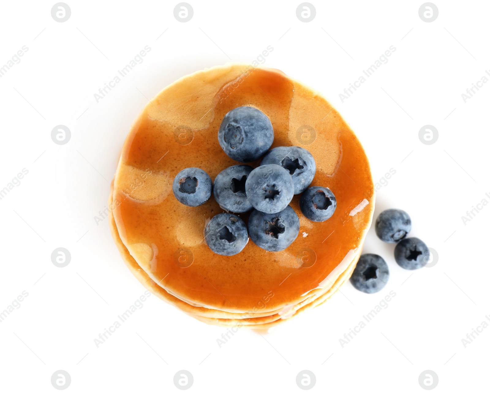 Photo of Delicious pancakes with fresh blueberries and syrup on white background, top view