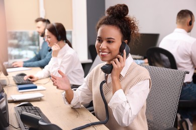 Call center operators working in modern office,