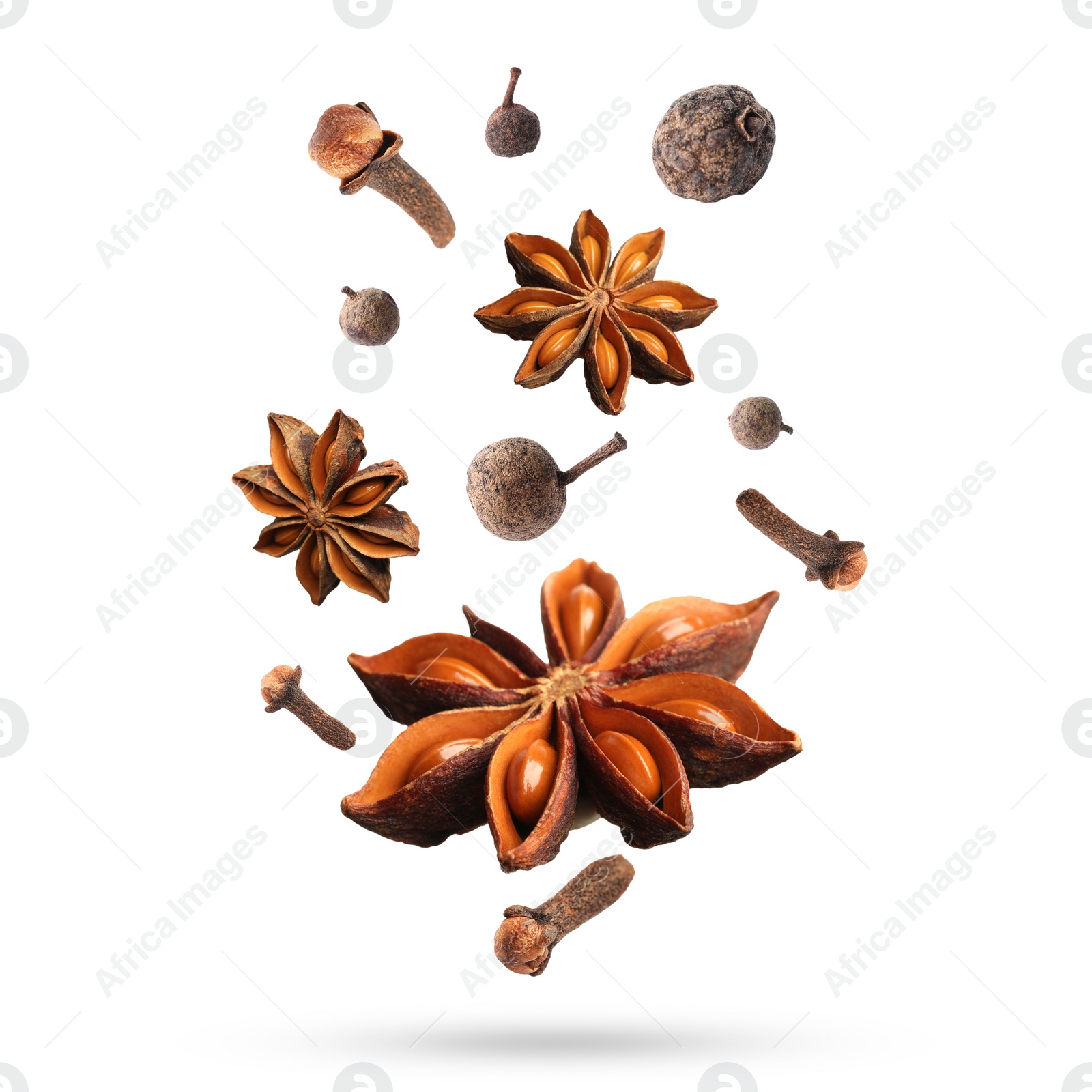 Image of Different aromatic spices falling on white background