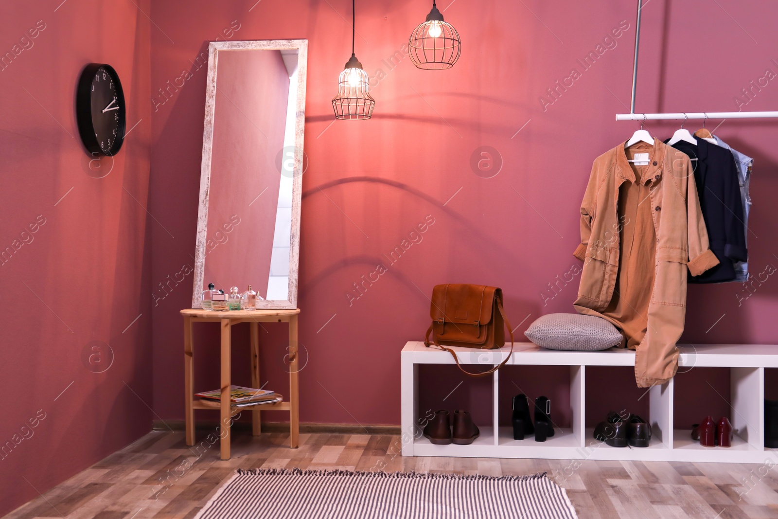 Photo of Modern hallway interior with hanging clothes and shoe rack