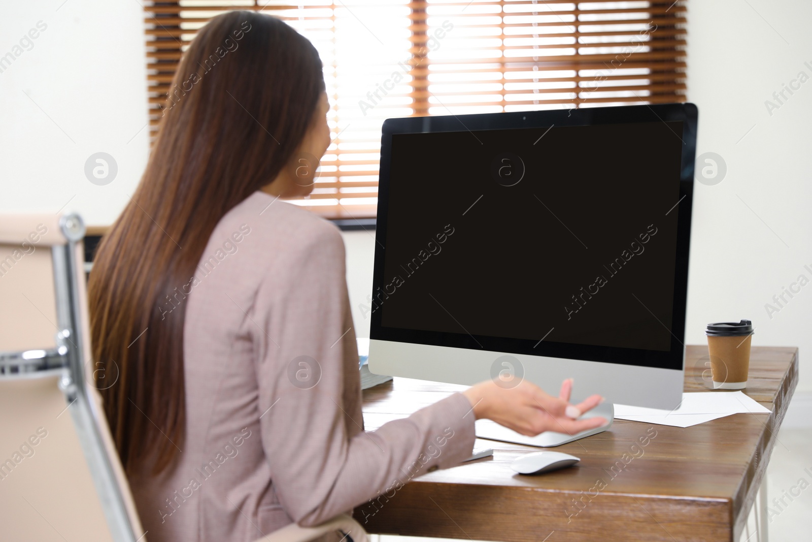 Photo of Woman using video chat on computer in home office. Space for text