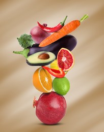 Image of Stack of different vegetables and fruits on pale light brown background