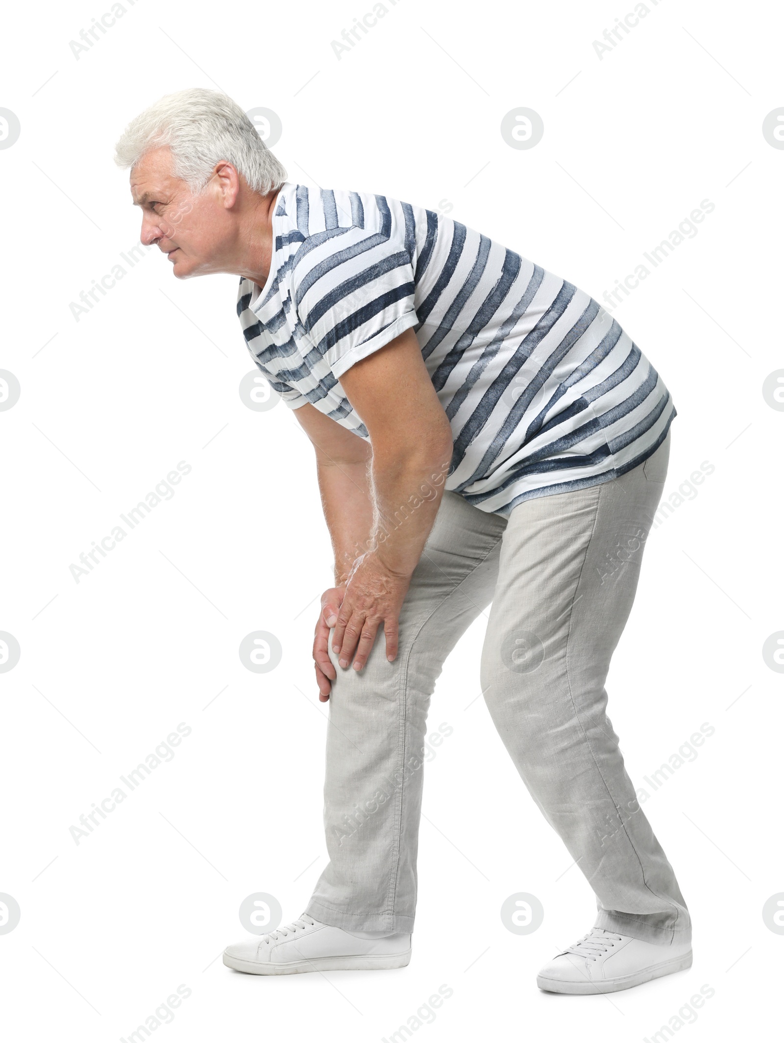 Photo of Full length portrait of senior man having knee problems on white background