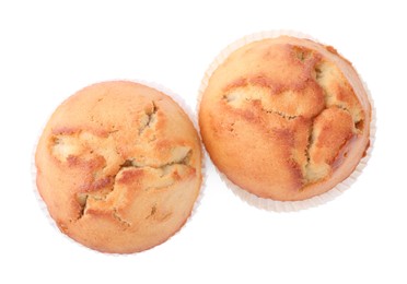 Tasty muffins on white background, top view