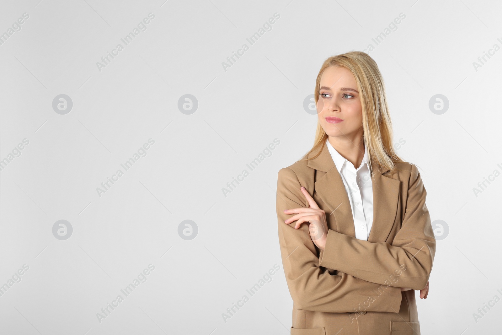 Photo of Portrait of young businesswoman on white background. Space for text