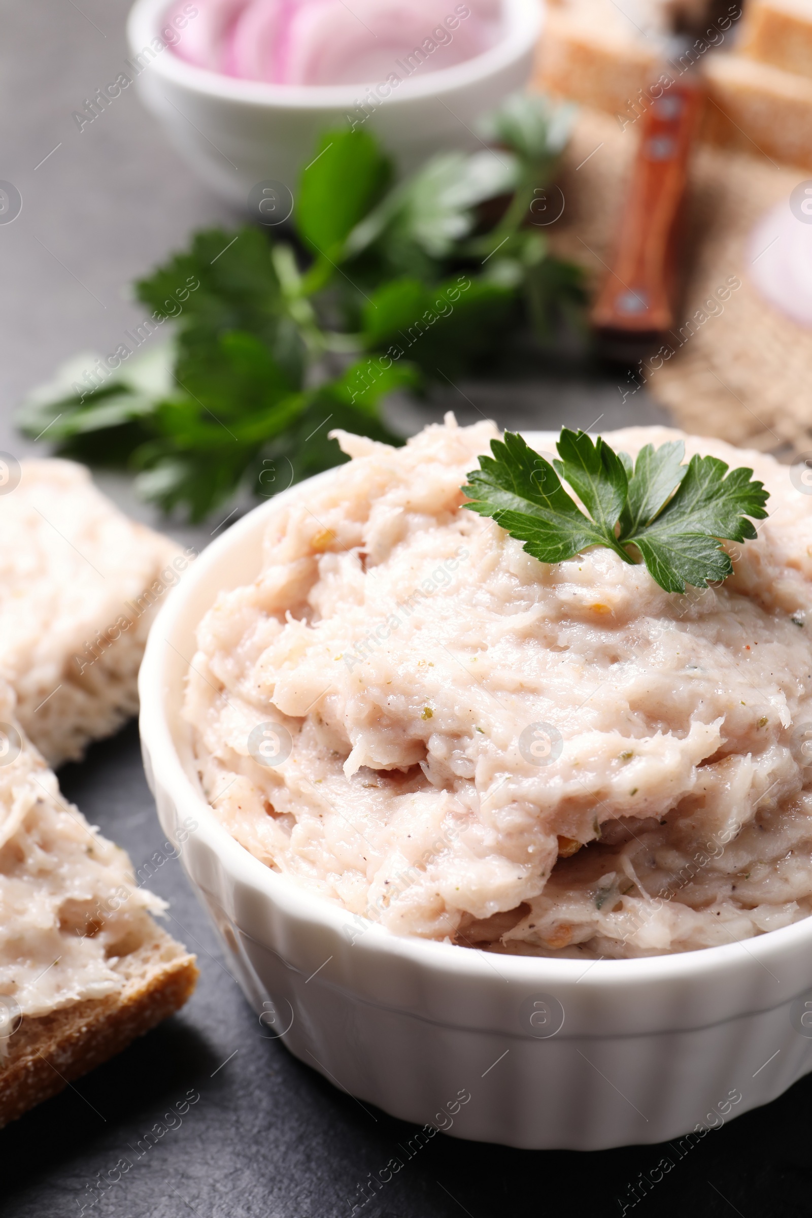 Photo of Delicious lard spread on grey table, closeup