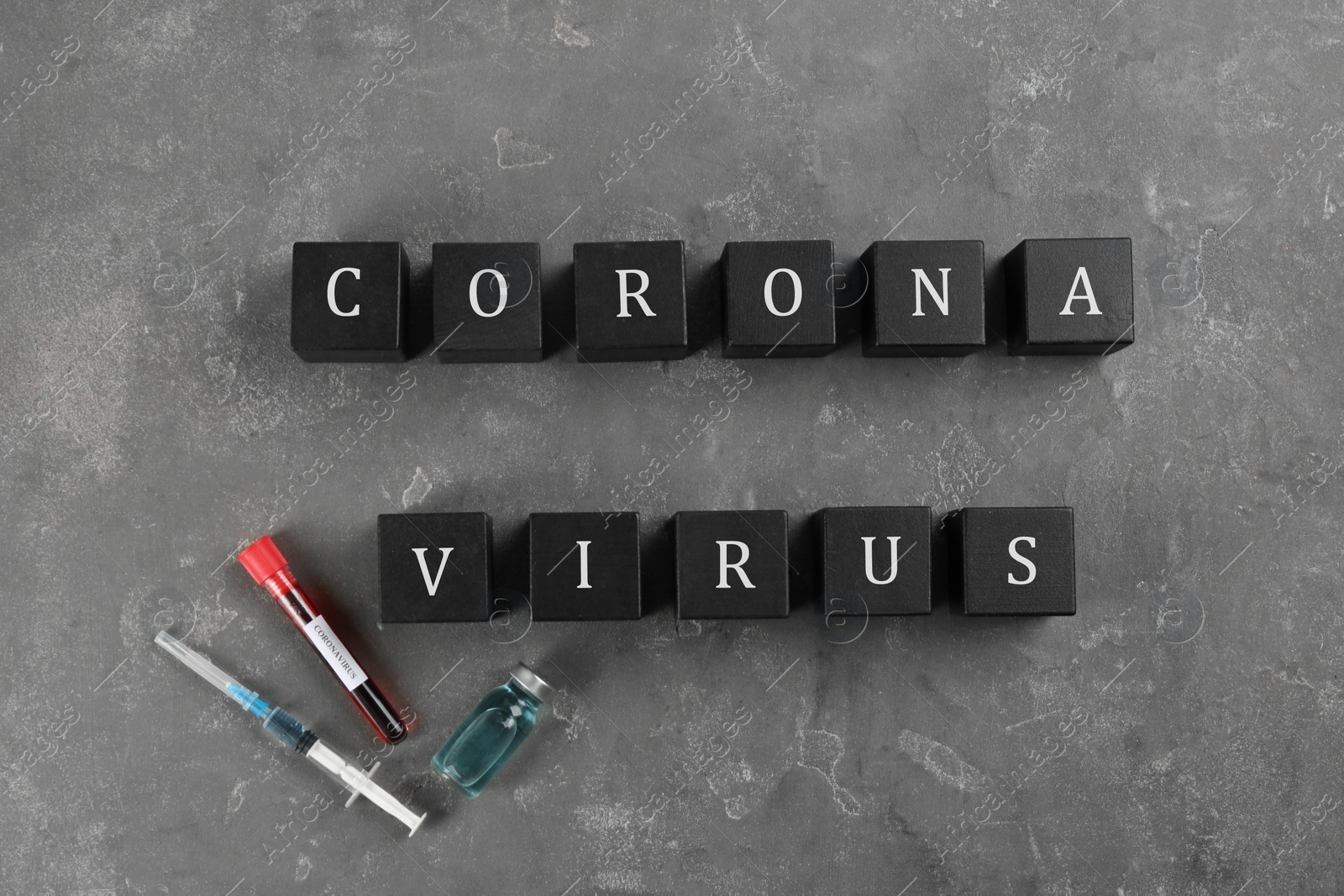 Photo of Cubes with words CORONA VIRUS on grey stone background, flat lay