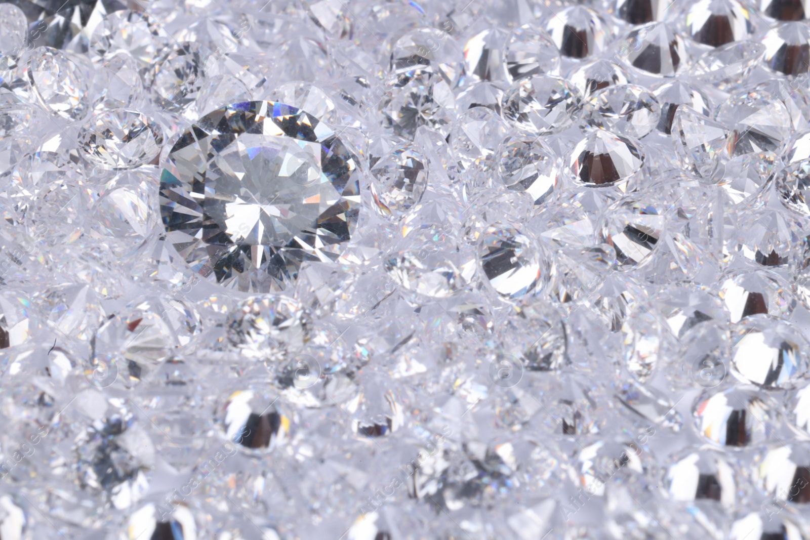 Photo of Many beautiful shiny diamonds as background, above view