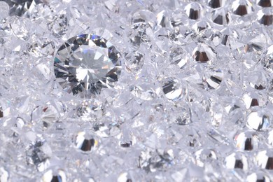 Photo of Many beautiful shiny diamonds as background, above view