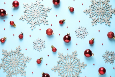 Photo of Flat lay composition with Christmas decorations on light blue background