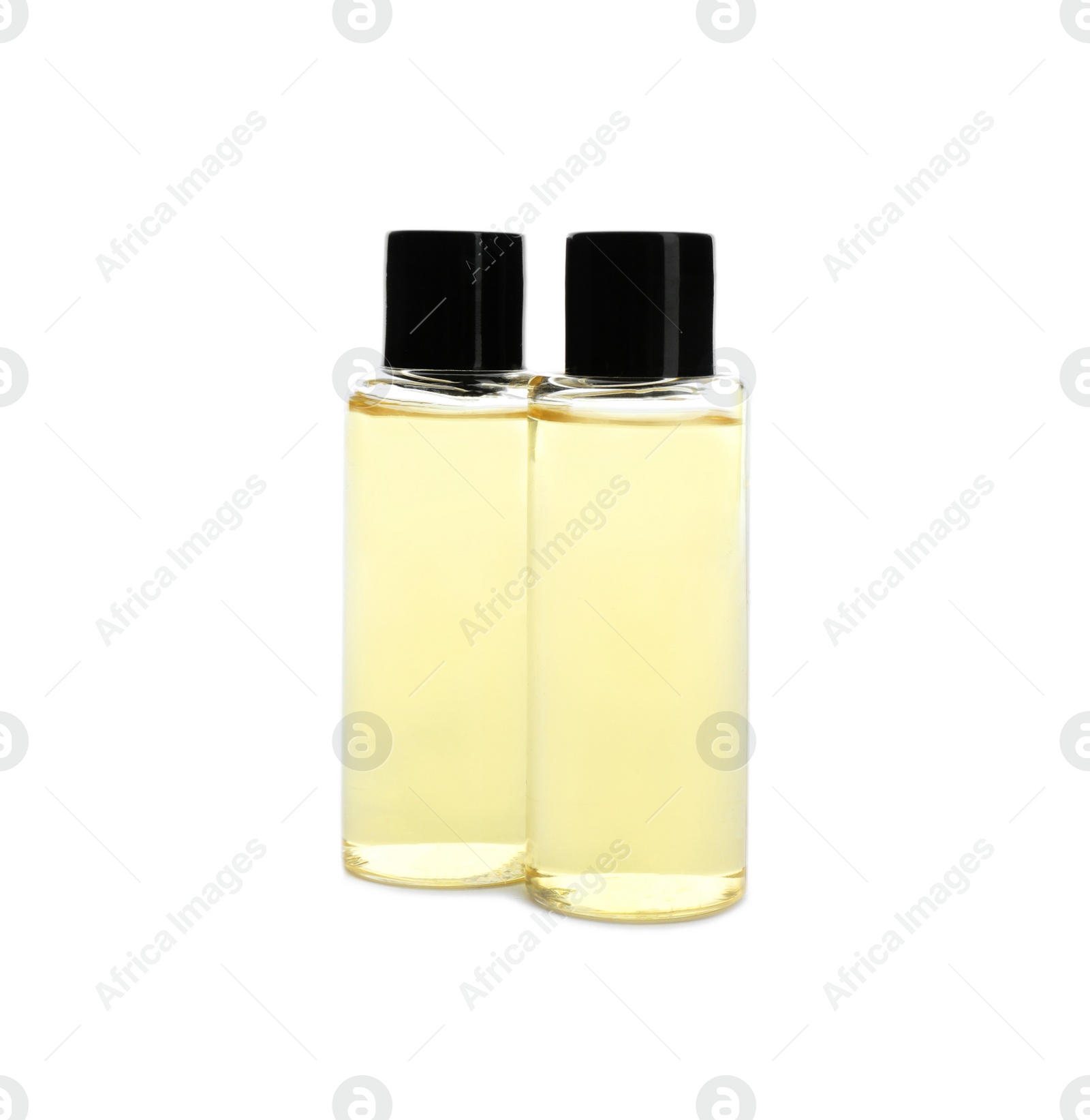 Photo of Mini bottles with cosmetic products on white background. Hotel amenities