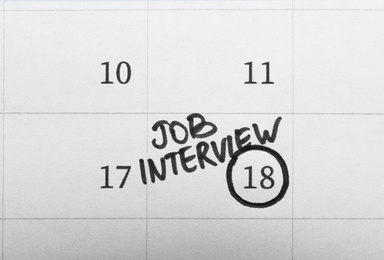 Calendar with date reminder about job interview, top view