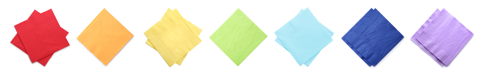 Image of Set with colorful paper napkins on white background, top view. Banner design