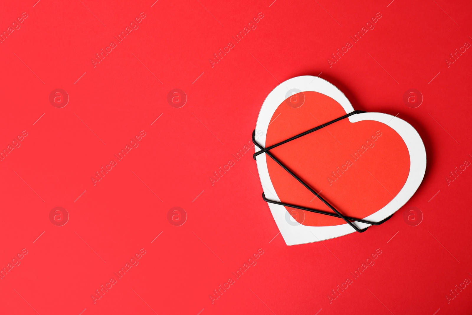 Photo of Decorated heart and space for text on color background, top view