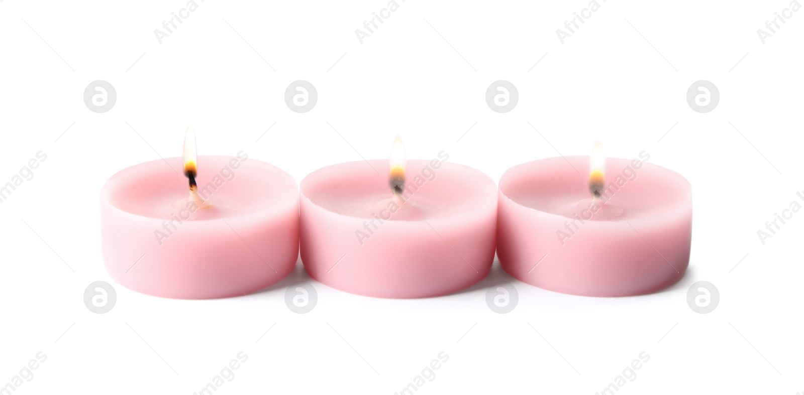 Photo of Pink wax decorative candles isolated on white