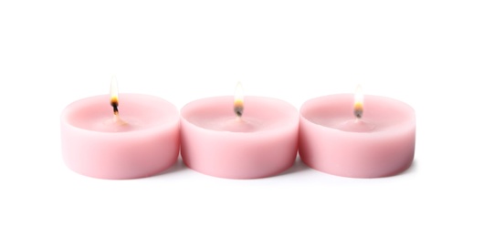 Photo of Pink wax decorative candles isolated on white