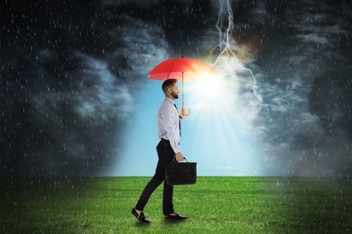 Image of Businessman with umbrella under heavy rain. Insurance concept