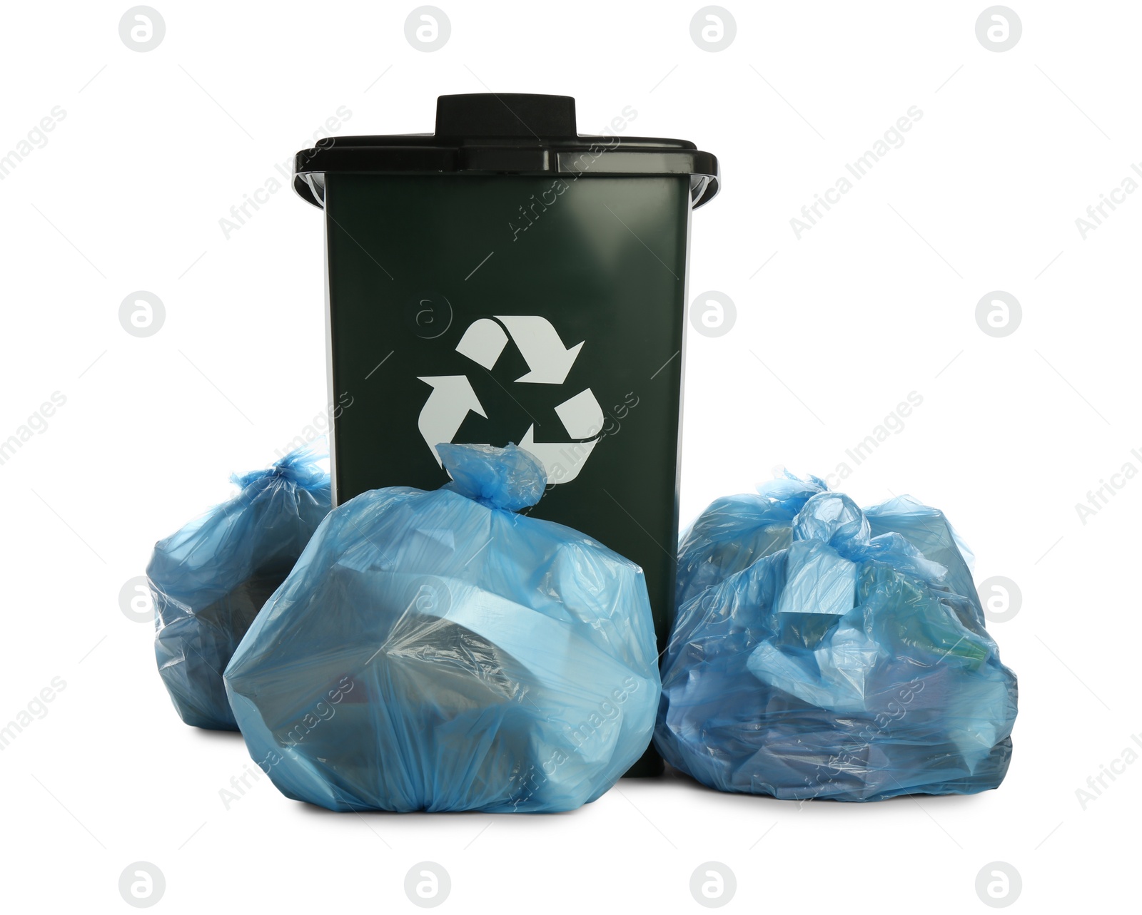 Photo of Trash bag filled with garbage near dark green recycling bin on white background