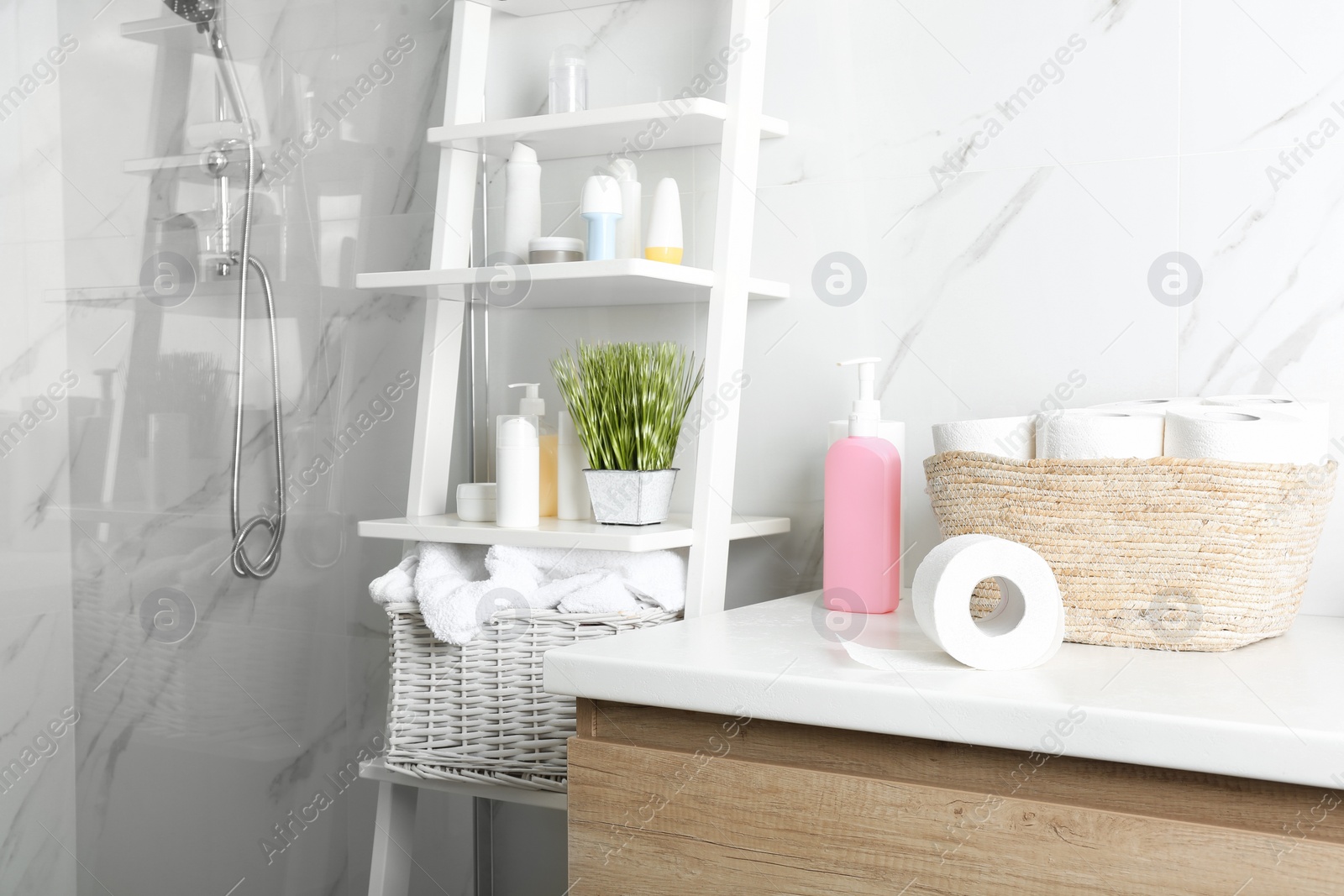 Photo of Toilet paper rolls on countertop in bathroom